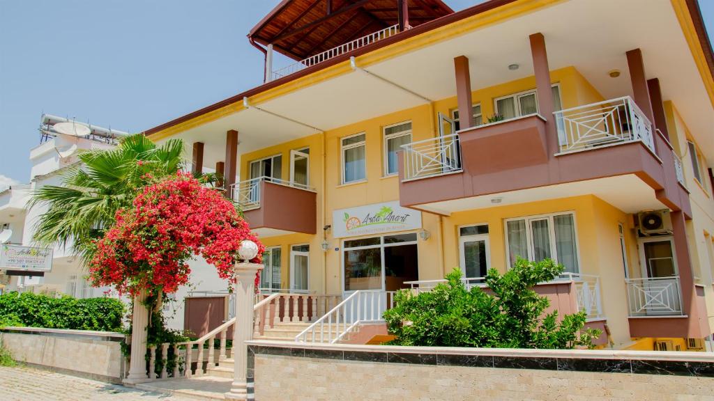 a building with flowers in front of it at Arda Apart Hotel in Kemer