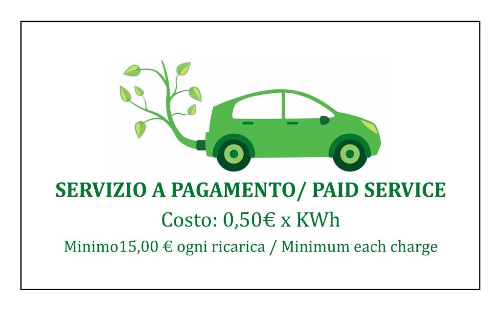 a green car with a tree growing out of it at Eco Hotel Montemerlo in Fetovaia