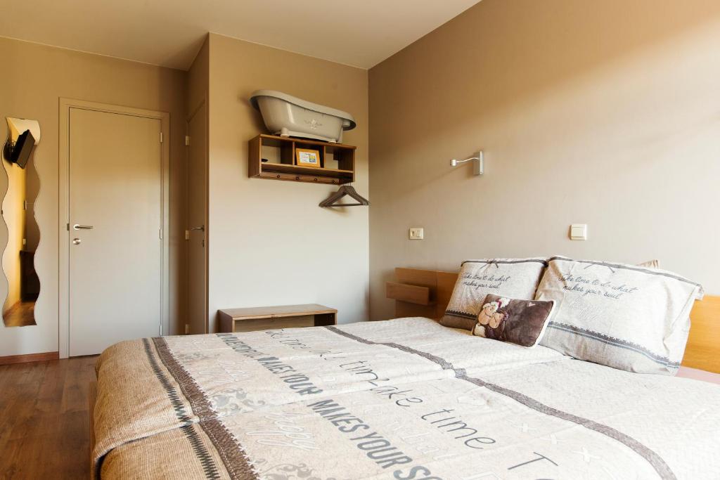 Postel nebo postele na pokoji v ubytování B&B Hoeve de Schapenkop