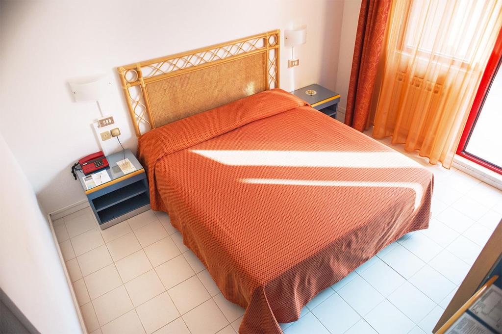 Postel nebo postele na pokoji v ubytování Hotel Palme
