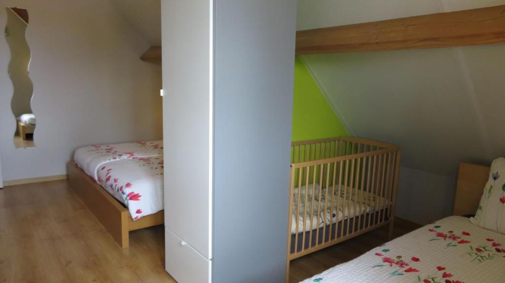 Postel nebo postele na pokoji v ubytování B&B Hoeve de Schapenkop