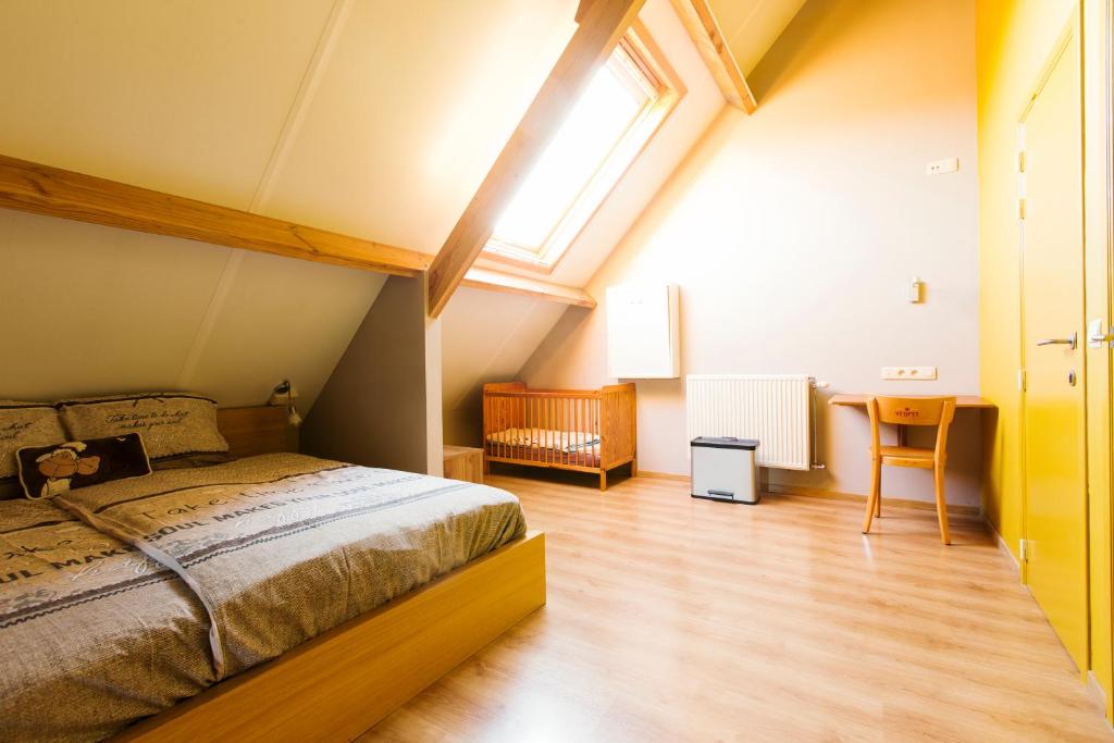 Postel nebo postele na pokoji v ubytování B&B Hoeve de Schapenkop