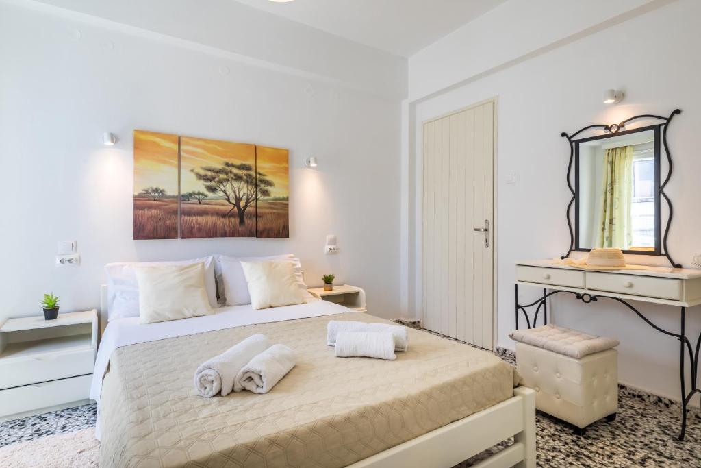 Postel nebo postele na pokoji v ubytování Marialena Rooms