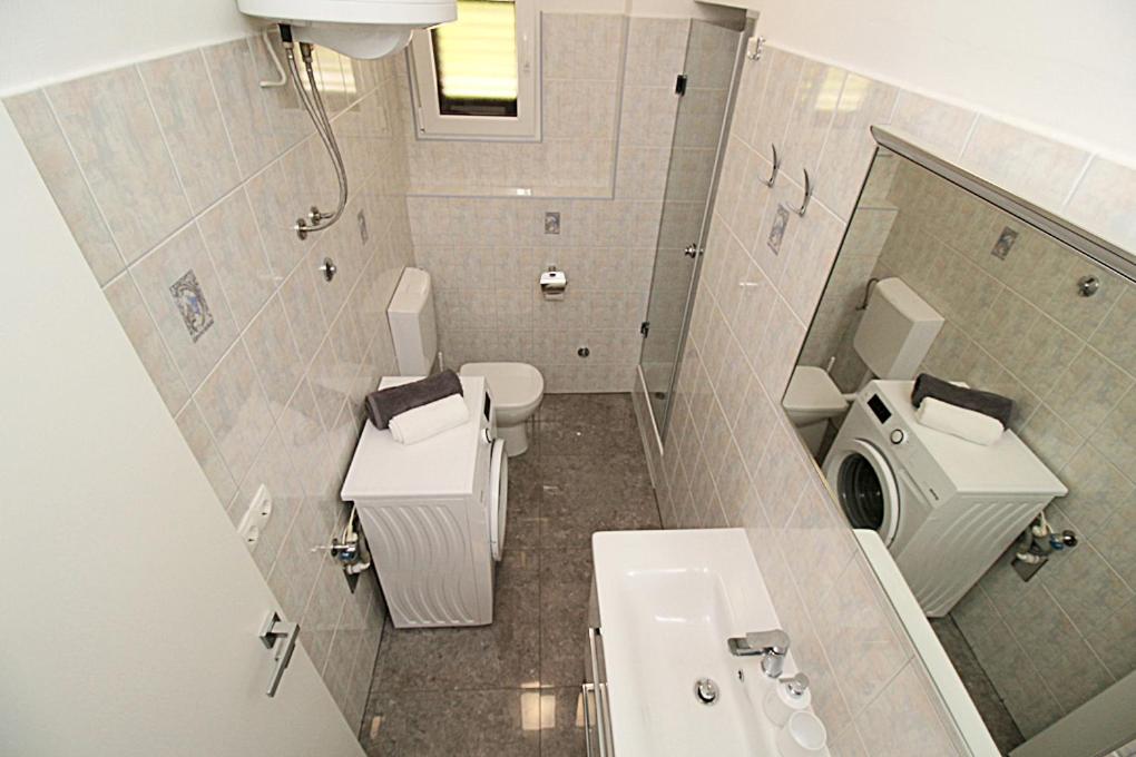 Koupelna v ubytování Apartments Angelo