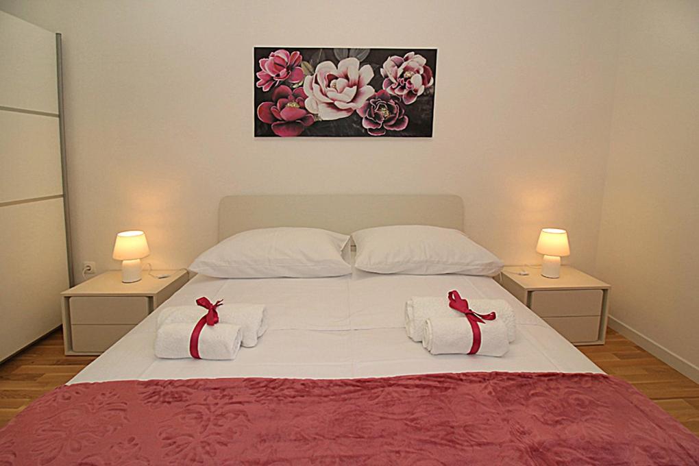Postel nebo postele na pokoji v ubytování Apartments Angelo