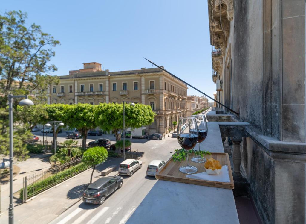 a balcony with a view of a city street at Anime Bed&Breakfast in Siracusa