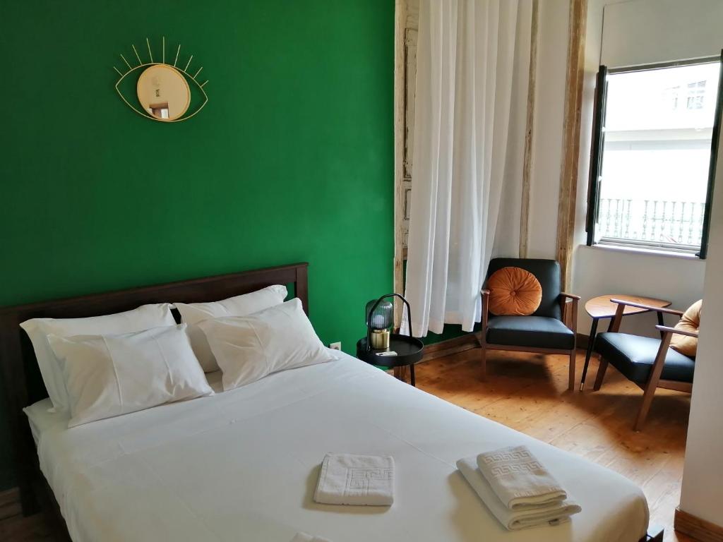 Postel nebo postele na pokoji v ubytování Tilia Hostel