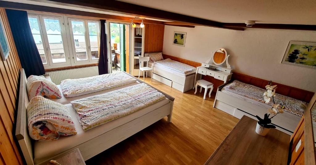 Postel nebo postele na pokoji v ubytování Hotel Rössli