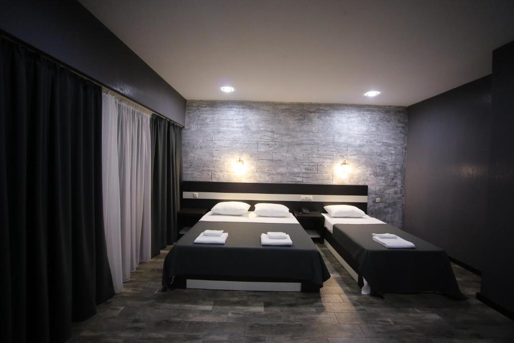 Voodi või voodid majutusasutuse West Tower Hotel toas