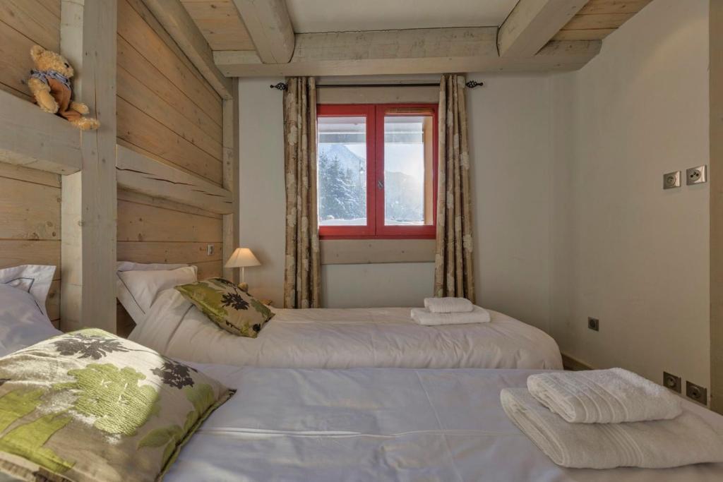 Posteľ alebo postele v izbe v ubytovaní La Blaitière - Luxe Apart Center Chamonix , Next to Piste Planard - By Cozee Rentals