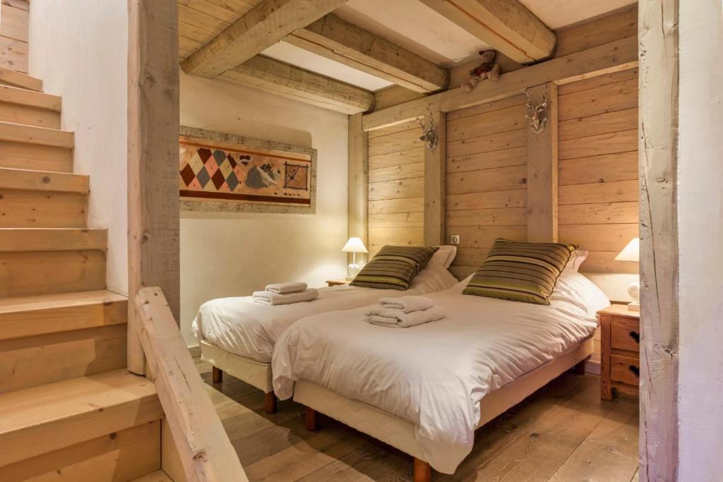 Posteľ alebo postele v izbe v ubytovaní La Blaitière - Luxe Apart Center Chamonix , Next to Piste Planard - By Cozee Rentals
