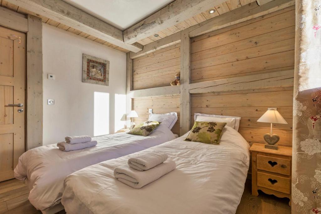 Posteľ alebo postele v izbe v ubytovaní La Blaitière - Luxe Apart Center Chamonix , Next to Piste Planard - By Cozee Rentals