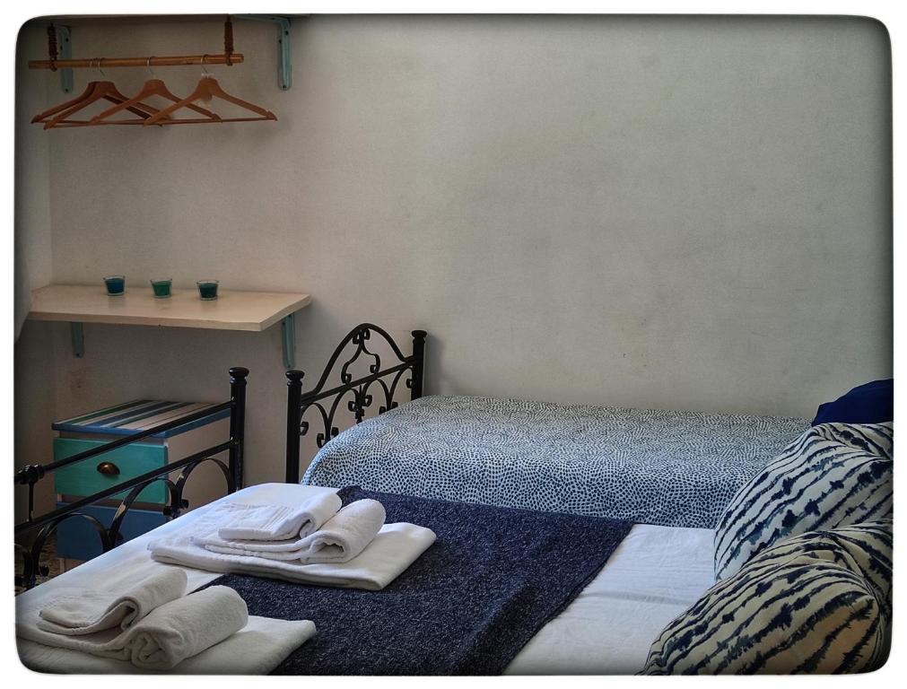 Postel nebo postele na pokoji v ubytování B&B il Faso vicino Zoosafari di Fasano