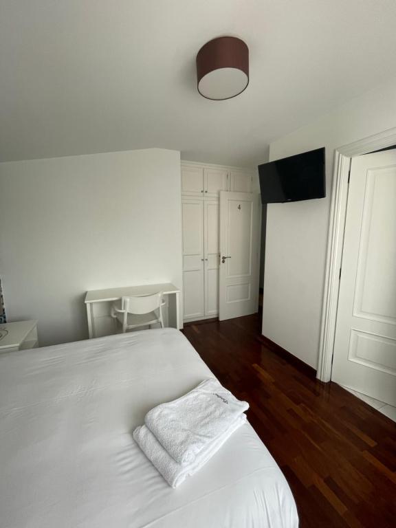 Posteľ alebo postele v izbe v ubytovaní Hostal Portofino