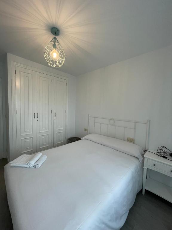 Posteľ alebo postele v izbe v ubytovaní Hostal Portofino