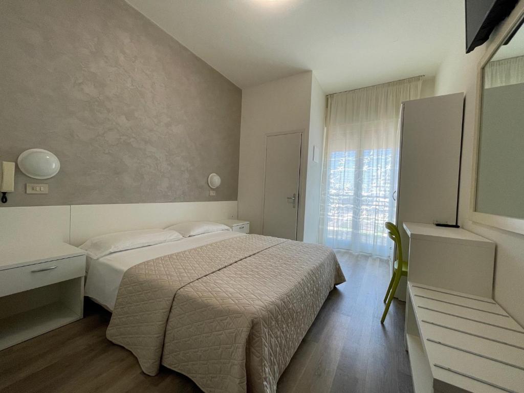 מיטה או מיטות בחדר ב-Hotel Cristina