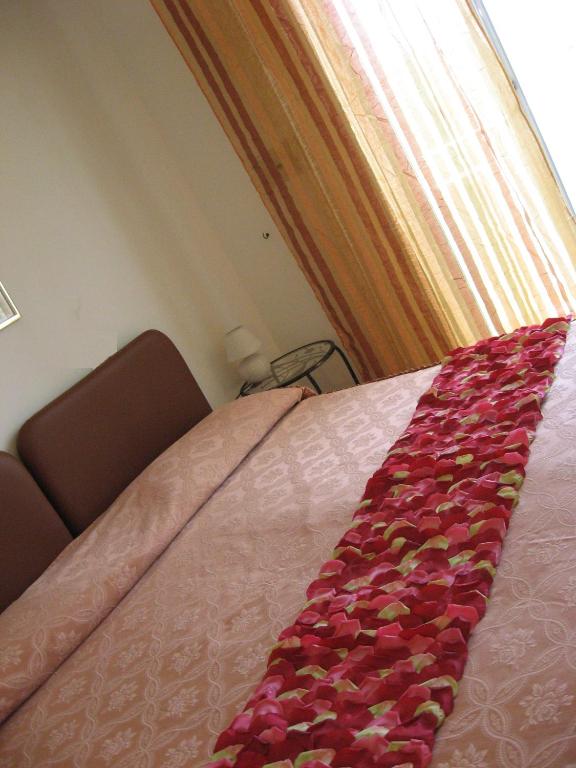 Postel nebo postele na pokoji v ubytování Hotel Rosati