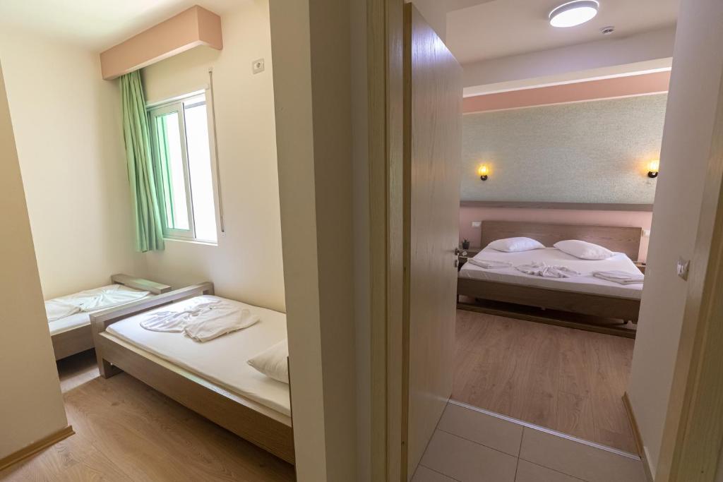 Postel nebo postele na pokoji v ubytování Hotel Picasso