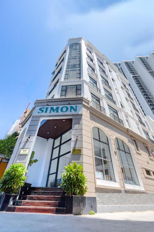 a building with a sign on the front of it at Simon Hotel in Nha Trang