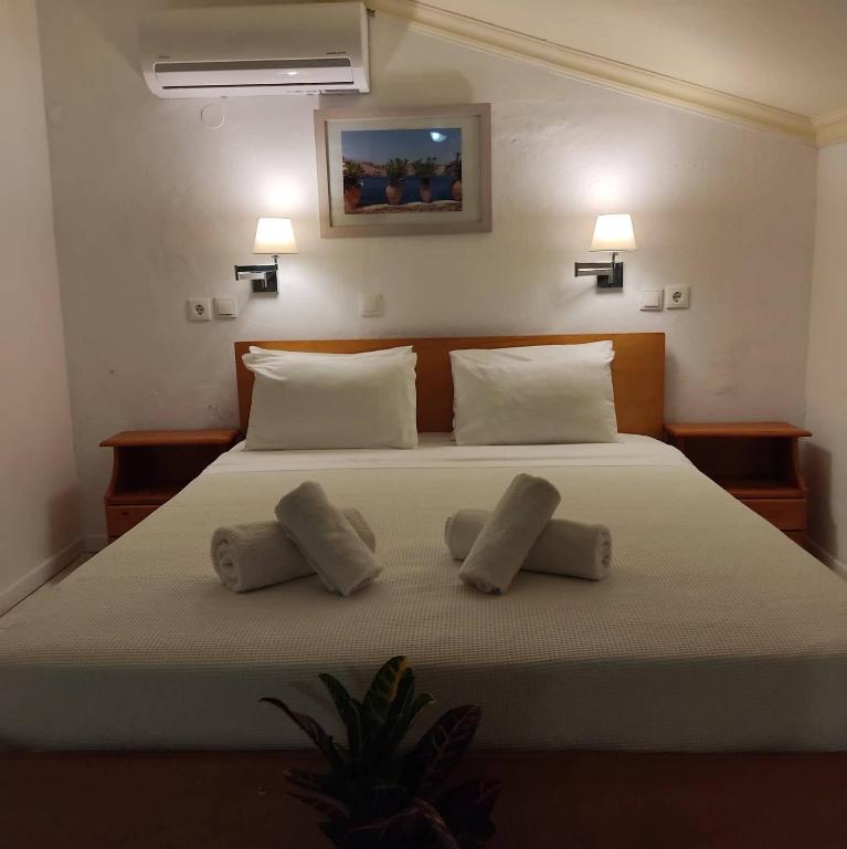 Postel nebo postele na pokoji v ubytování Anastasia Hotel