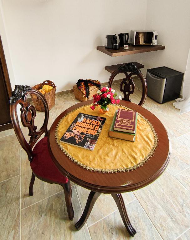 a table with a cake on top of it at Quinta dos Padrinhos - Suites in the Heart of the Douro in Lamego
