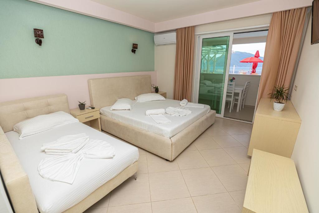 Postel nebo postele na pokoji v ubytování Hotel Picasso