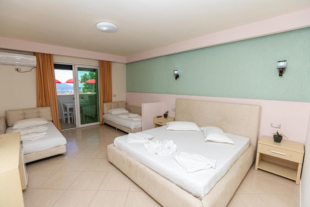 Postel nebo postele na pokoji v ubytování Hotel Picasso