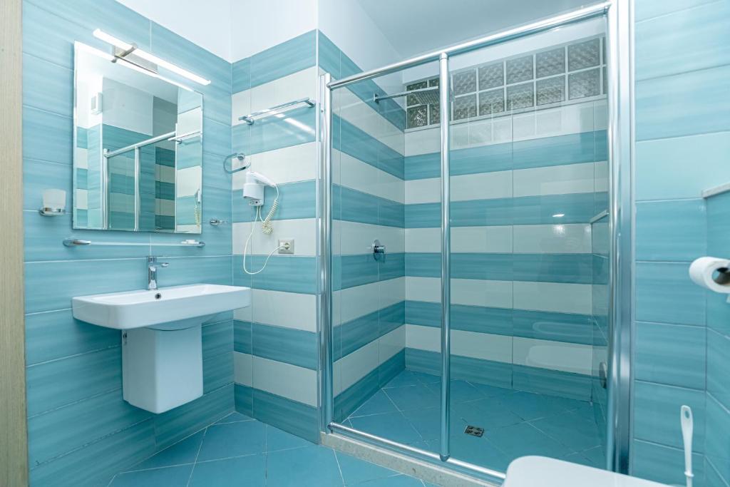 Koupelna v ubytování Hotel Picasso