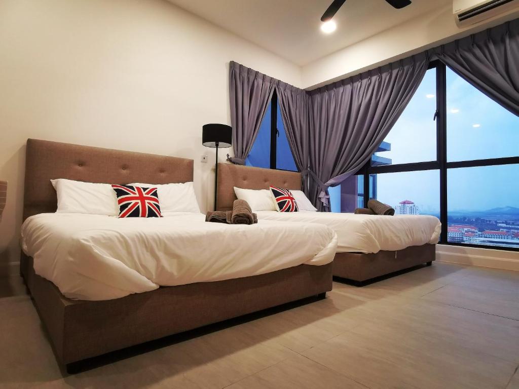 Postel nebo postele na pokoji v ubytování Bell Suite - The Premium Suite @ Sepang