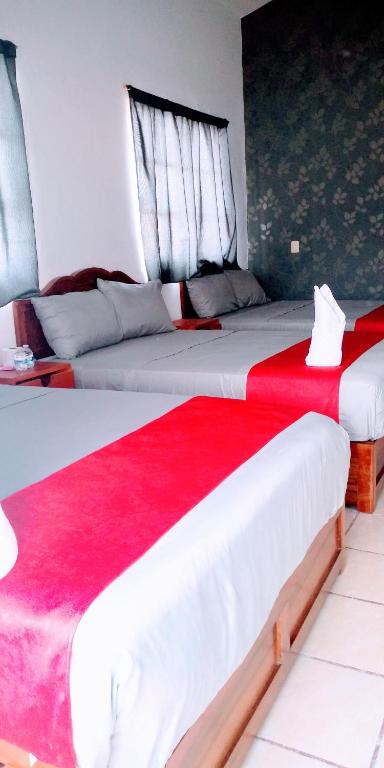 Postel nebo postele na pokoji v ubytování Hotel La Intimidad