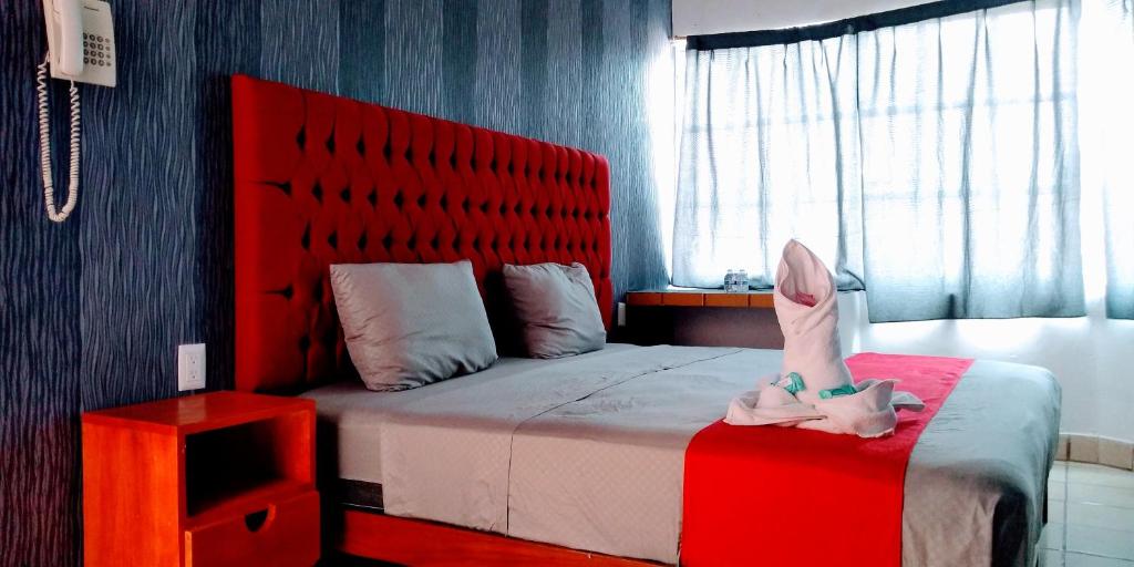 Postel nebo postele na pokoji v ubytování Hotel La Intimidad