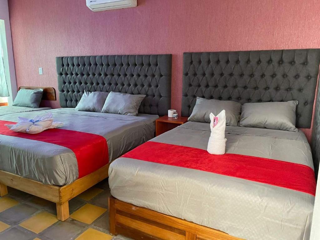 Postel nebo postele na pokoji v ubytování Hotel La Intimidad