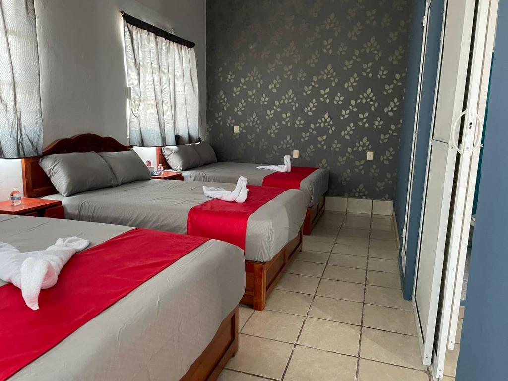 Postel nebo postele na pokoji v ubytování Hotel La Intimidad