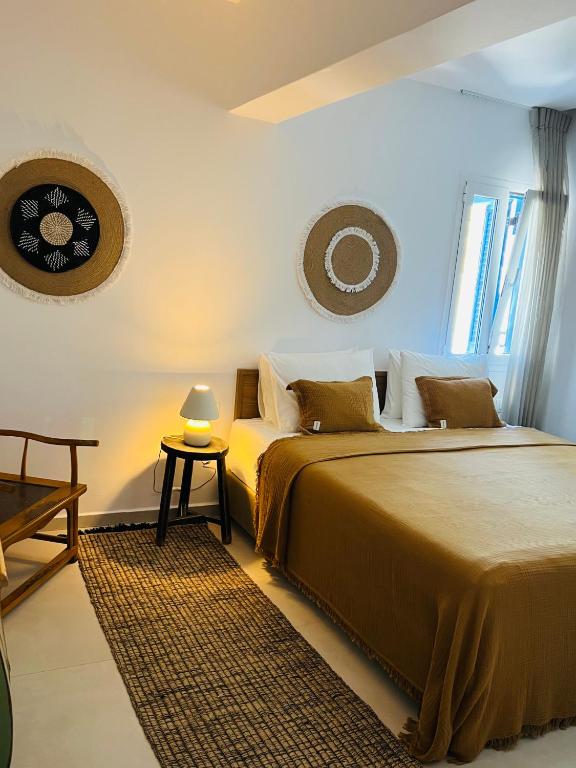 Posteľ alebo postele v izbe v ubytovaní Portobello Boutique Hotel