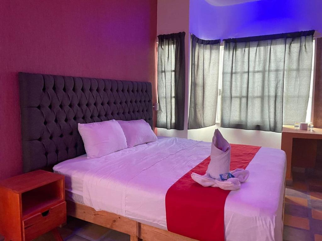 Postel nebo postele na pokoji v ubytování Hotel La Intimidad