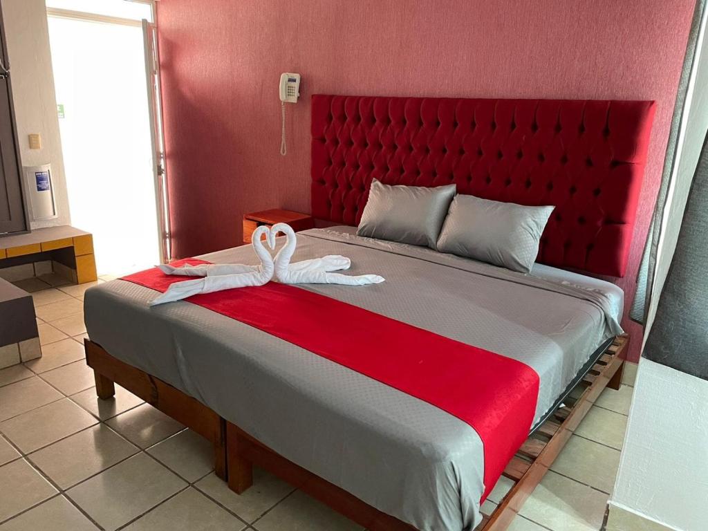 Postel nebo postele na pokoji v ubytování Hotel La Intimidad