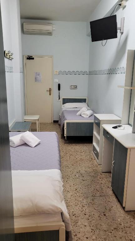 Postel nebo postele na pokoji v ubytování Hotel Viscount