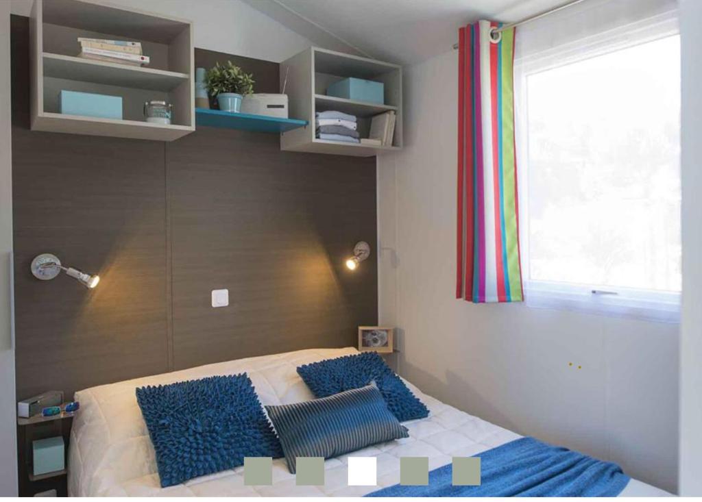 Postel nebo postele na pokoji v ubytování Camping Paradis le Moulin des Oies