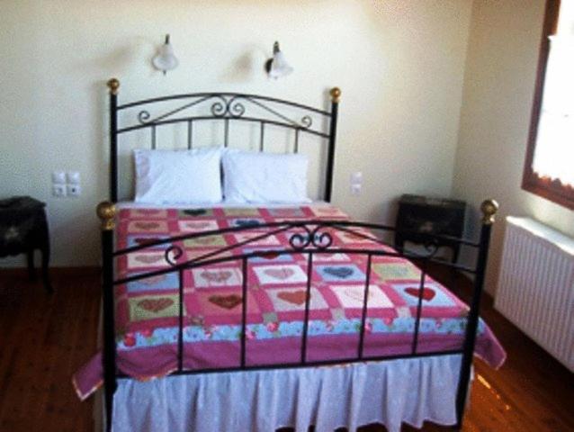Łóżko lub łóżka w pokoju w obiekcie Guesthouse Kolenti