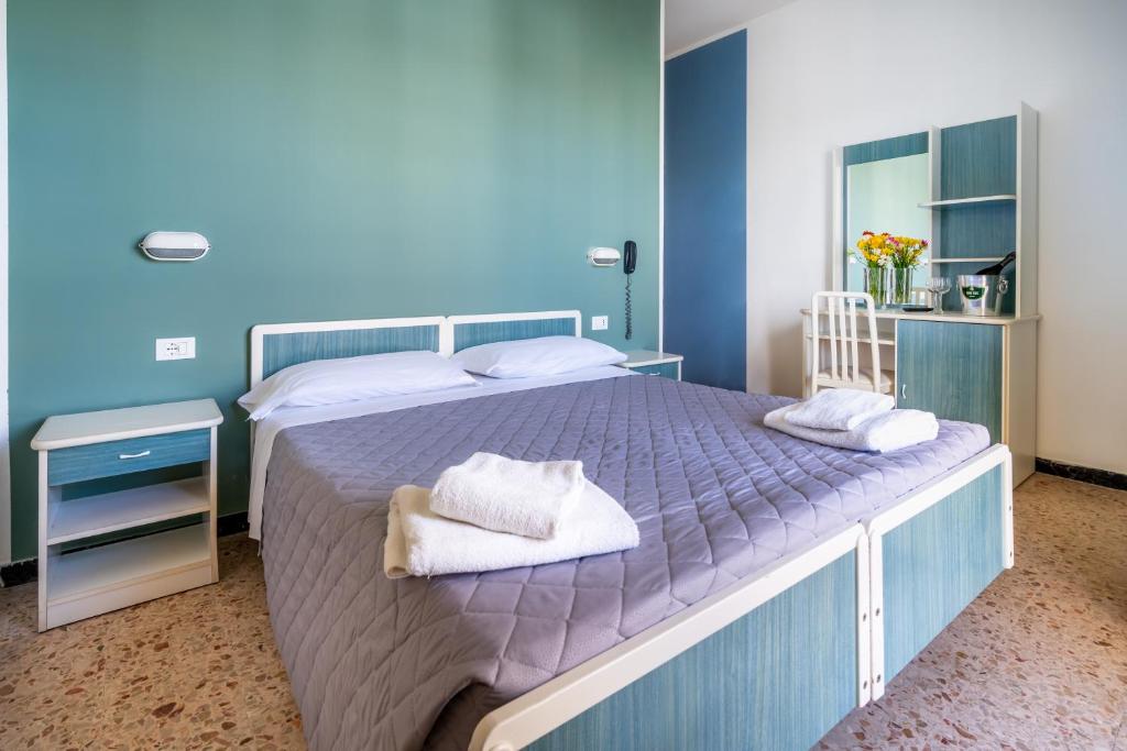 Postel nebo postele na pokoji v ubytování Hotel Viscount