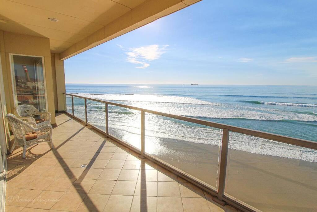 a balcony with a view of the ocean at ACCESS - BEACH Penthouse PAPAS and BEER 2 miles WIFI in Rosarito