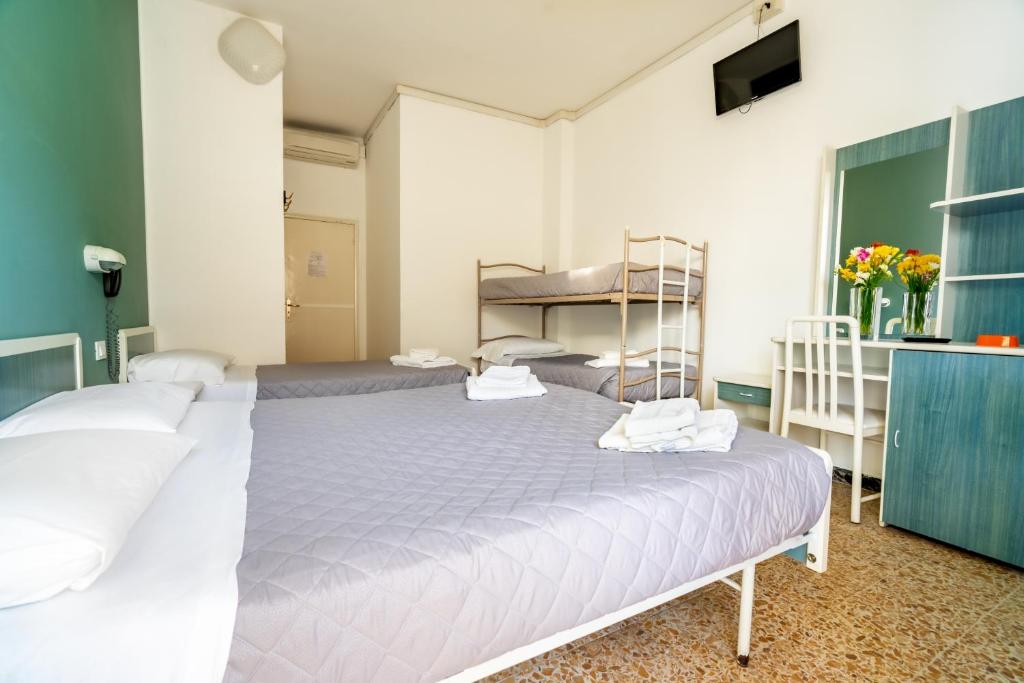 Postel nebo postele na pokoji v ubytování Hotel Viscount