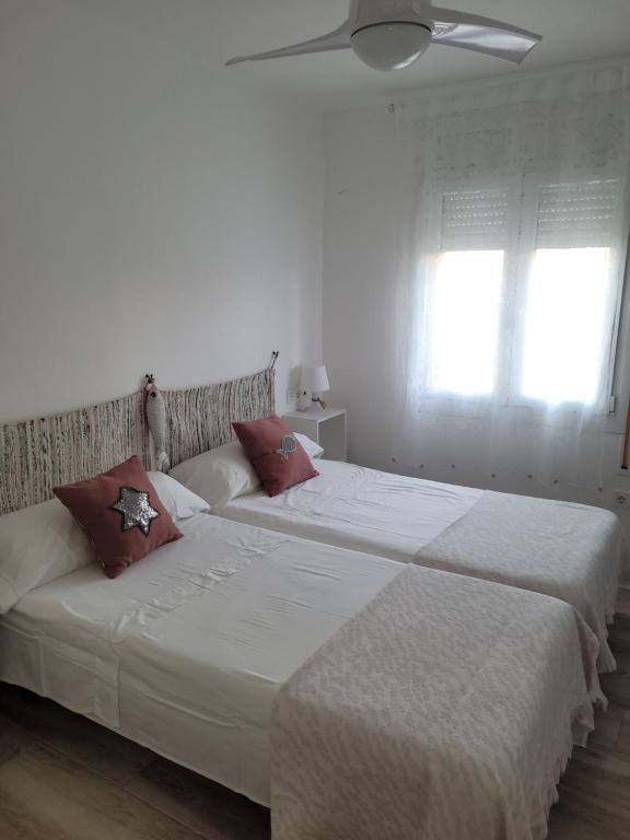 Posteľ alebo postele v izbe v ubytovaní Apartamento Apolo