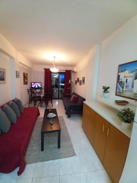 a living room with a couch and a table at Old Town apartment 2 in Larnaca