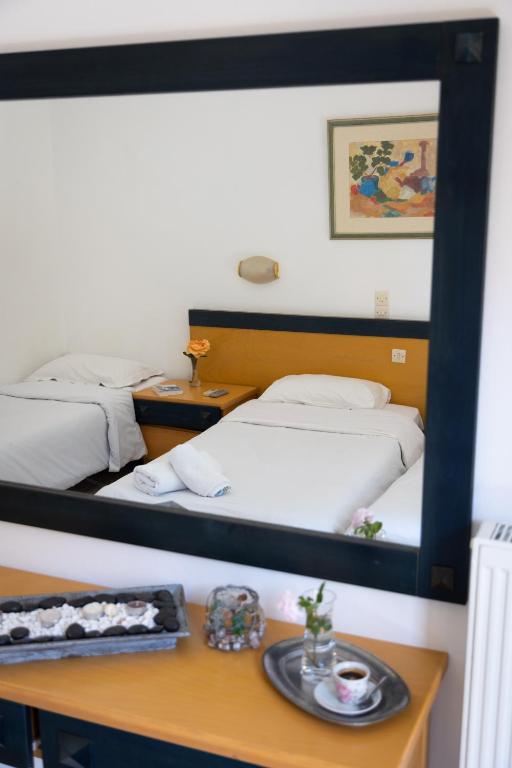 Postel nebo postele na pokoji v ubytování Wilde Rose Hotel