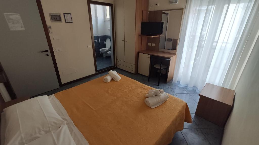 Postel nebo postele na pokoji v ubytování Hotel Corona