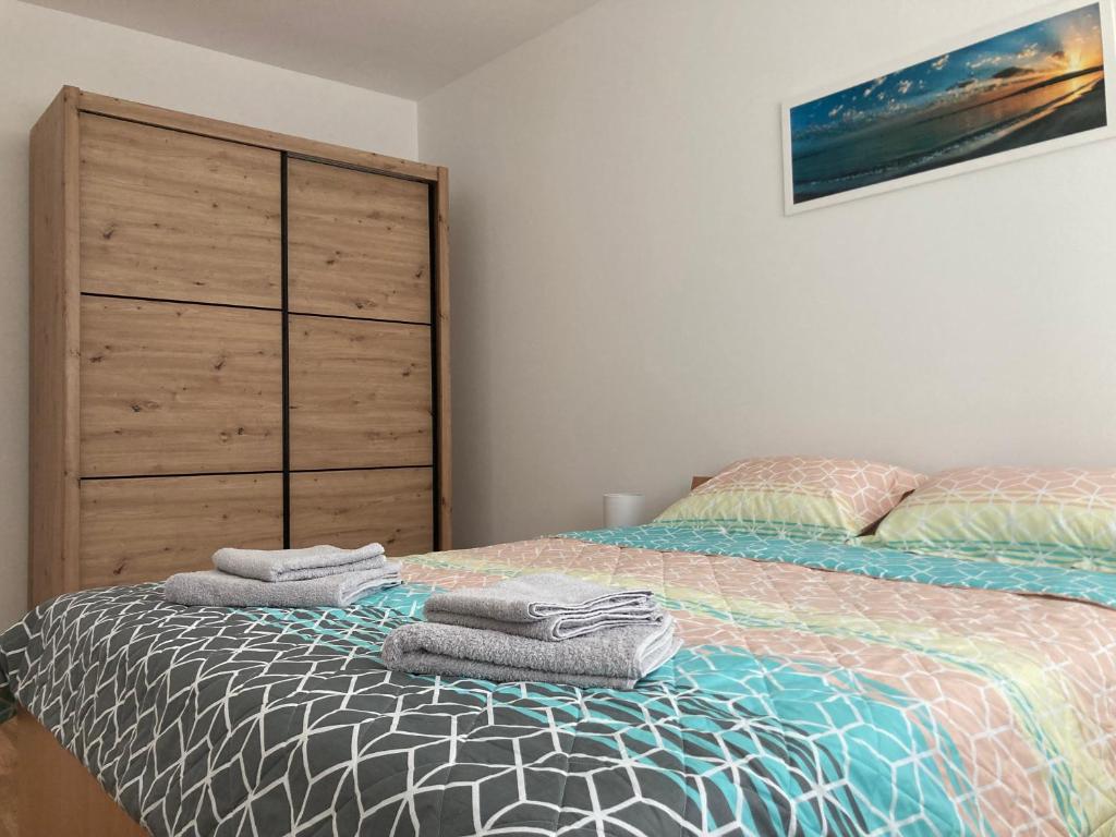 Postel nebo postele na pokoji v ubytování Apartman N&N