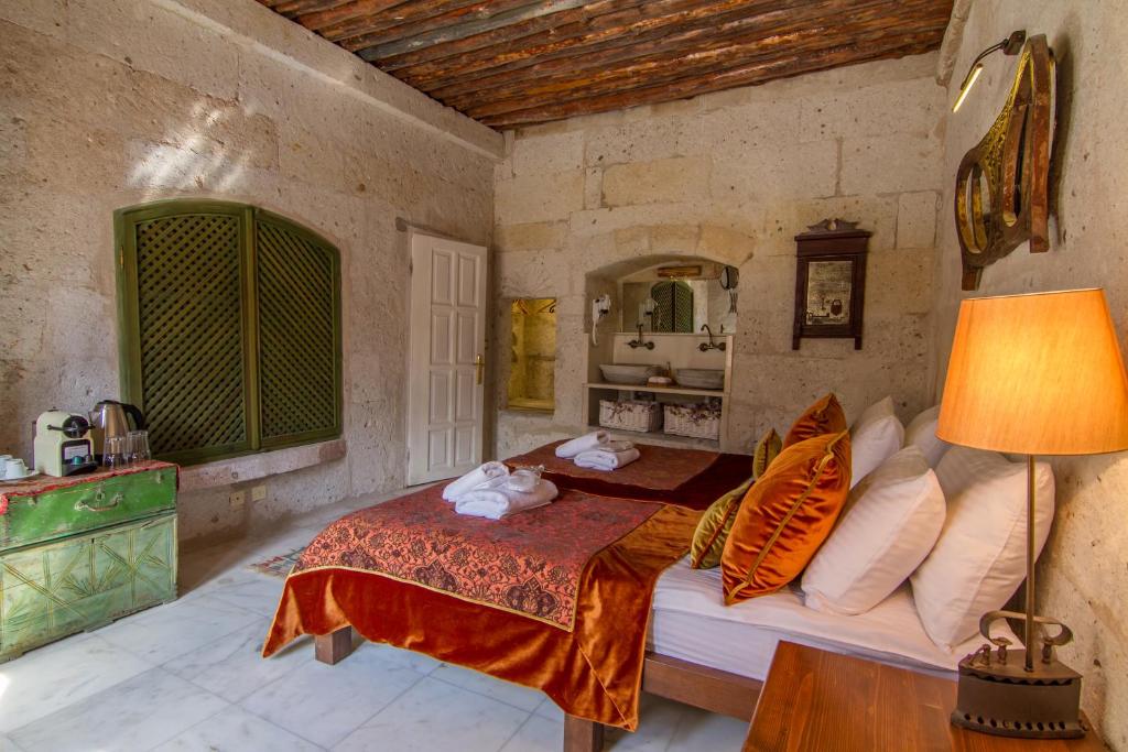 Postel nebo postele na pokoji v ubytování Rox Cappadocia