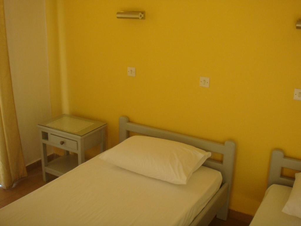 Postel nebo postele na pokoji v ubytování Omiros