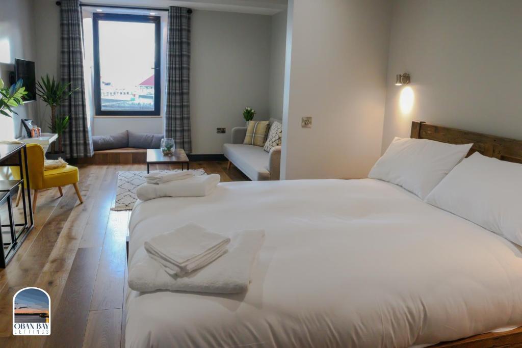 Postel nebo postele na pokoji v ubytování Oban Bay Apartments